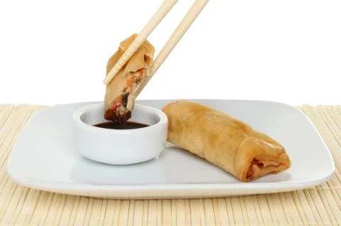 Spring roll in chopsticks Stock Photos