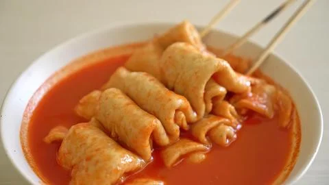 Spring roll dish with spicy tomato sauce served in a white bowl Stock Photos