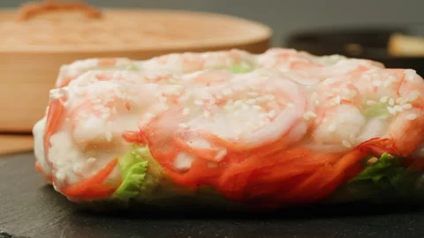 Spring roll with shrimps and vegetables inside close-up macro. Shrimp roll with Stock Footage 256725903