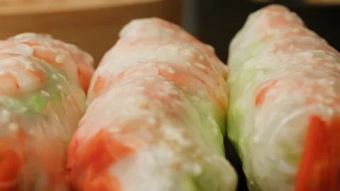Spring roll with shrimps and vegetables inside close-up macro. Shrimp roll with Stock Footage 257593292