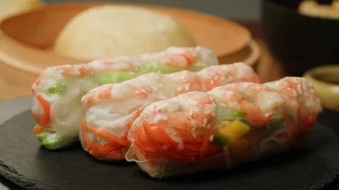 Spring roll with shrimps and vegetables inside close-up macro. Shrimp roll with Stock Footage 257596361