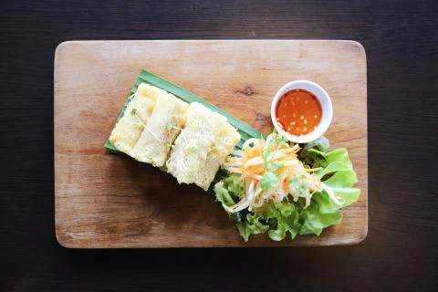 Spring roll on wood background Stock Photos