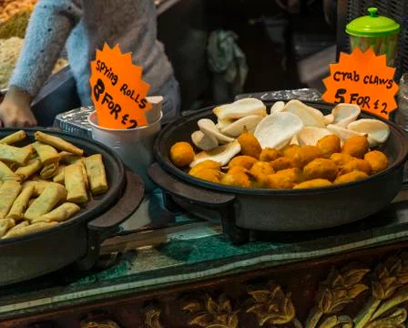 Spring rolls and crab claws exposed in camden town Stock Photos