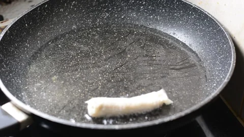 Spring rolls in deep oil Stock Footage 144494190