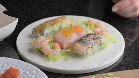 Spring rolls in rice paper, preparation. Close-up of a spring roll with Stock Footage 274348536