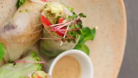Spring rolls with shrimp, crispy vegetables and peanut sauce. An incredibly Stock Footage 149980263