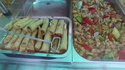 Spring rolls vegetable rice noodles and other Chinese courses at buffet restaura Stock Footage 83245441