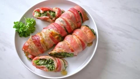 Spring rolls with vegetables and herbs on a white plate Stock Photos