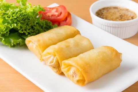 Spring rolls on white dish 스톡 사진