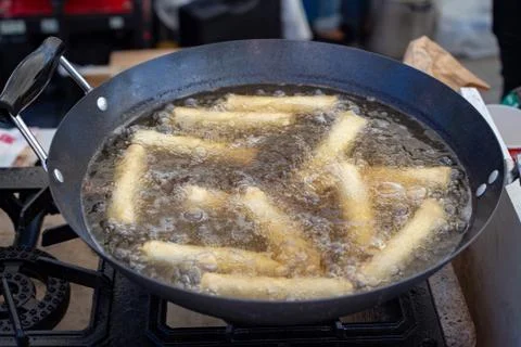 Spring rolls in a wok Stock Photos