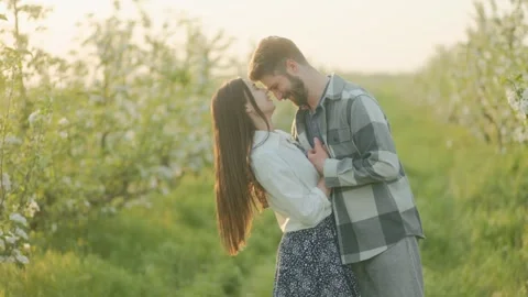 Spring Romance A Young Couple Hugging in the Countryside Stock Footage 307796575