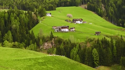 Spring rural landscape of alpine meadow in Dolomites Alps with small villageand Stock Footage 265144300