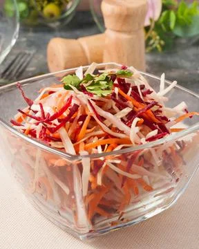 Spring salad with cabbage beetroot carrot in a glass bowl Stock Photos