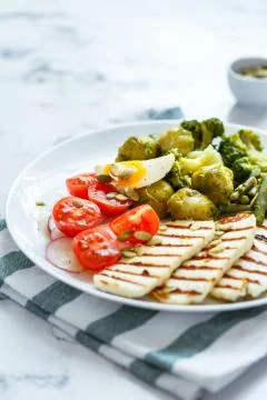 Spring salad with grilled cheese Stock Photos