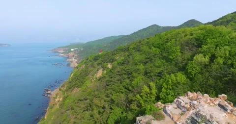 Spring seaside scenery of Binhai Road in Dalian, Liaoning province, China Stock Footage 241406061