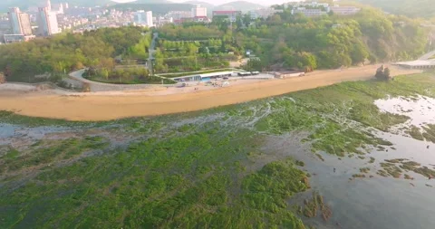 Spring seaside scenery of Binhai Road in Dalian, Liaoning province, China Vídeos de archivo 241407042