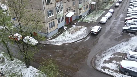 Spring snow and rain on a cloudy windy day. Abnormal phenomena in spring Stock Footage 308974428