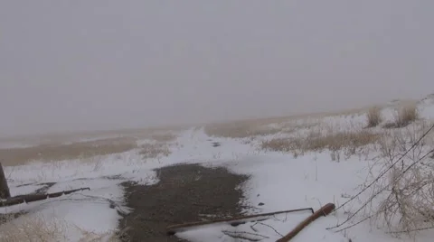 Spring snow covers a remote and deserted country road. Stock Footage 49790221