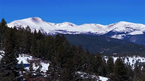 Spring snow Evergreen Mount Blue Sky Front Range Rocky Mountains Colorado Stock-Footage 334116834