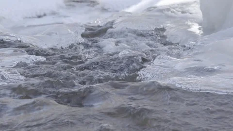 Spring snow melt running stream Stockbeeldmateriaal 87339686