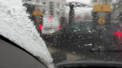 Spring snow melting on a car windshield, Legionowo Stock Footage 306300342