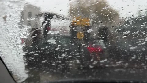 Spring snow melting on a car windshield, Legionowo Stock Footage 306300343