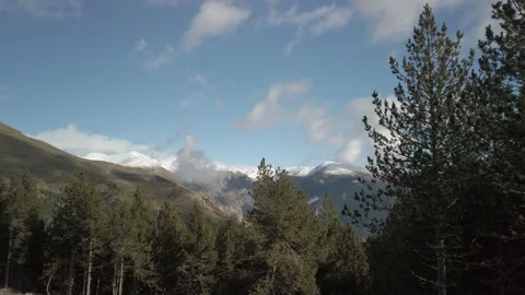 Spring snow mountain valley in a sunny day Stock Footage 180974439