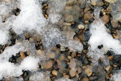 Spring snow on the rocks. snow patterns, textured Stock Photos