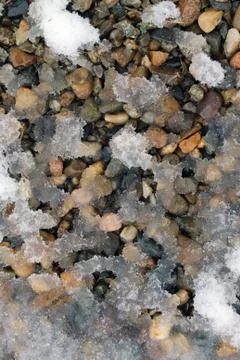 Spring snow on the rocks. snow patterns, textured Stock Photos