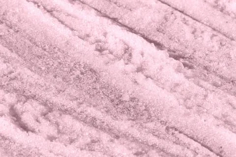 Spring snow texture close up. Abstract winter background pink color toned 스톡 사진