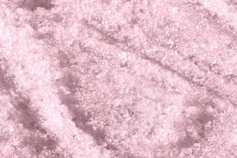 Spring snow texture close up. Abstract winter background pink color toned Stock-Fotos