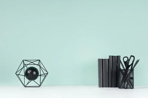 Spring soft students workplace with black stationery, books and decoration at Stock Photos