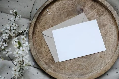 Spring still life composition. Blank greeting card mockup, craft envelope Photos