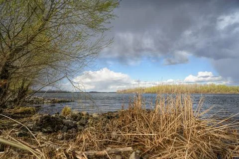 Spring Storm Over the River Fotos Stock