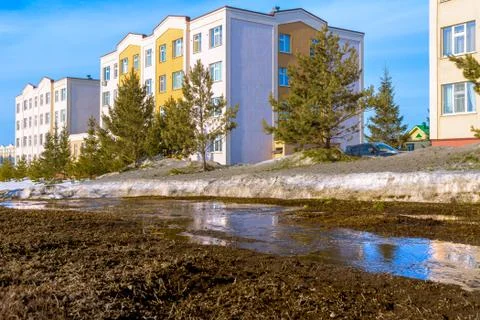 Spring streams of snow melting in spring in middle of houses, Residential are Stock Photos