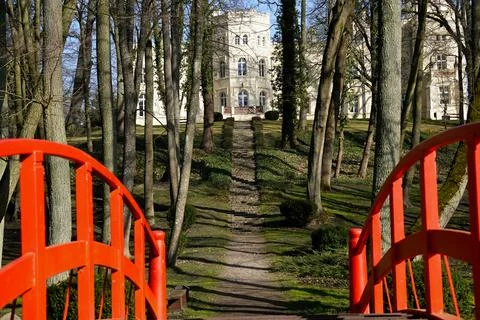 Spring sun park with a view of the palace in the distance Stock Photos