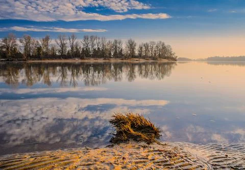 Spring sunrise over the river Stock Photos