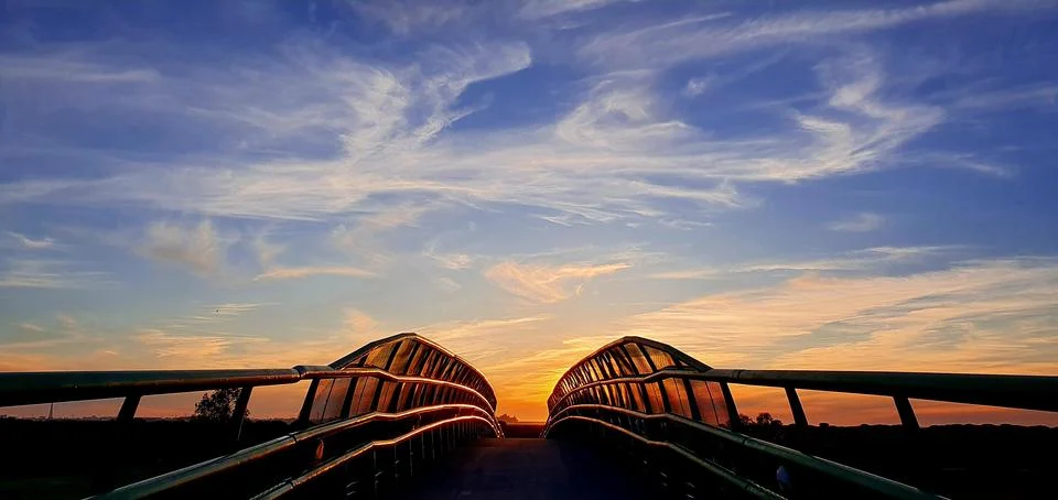 Spring sunset over a bridge. 库存照片