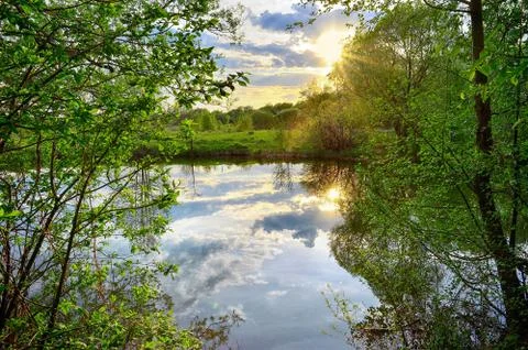 Spring sunset on the river Stock Photos
