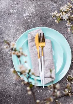 Spring table setting with blooming branch Stock Photos