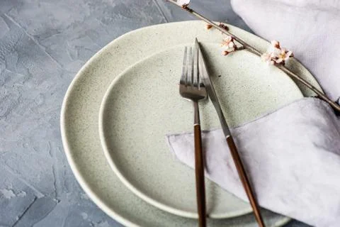 Spring table setting with blooming tree branch Stock Photos