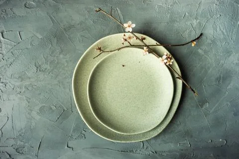 Spring table setting with blooming tree branch Stock-Fotos