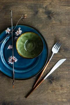 Spring table setting with blooming tree branch Stock Photos
