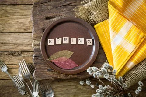Spring table setting. Cutley on wood. Flatlay overhead shot. Wooden letters w Stock Photos