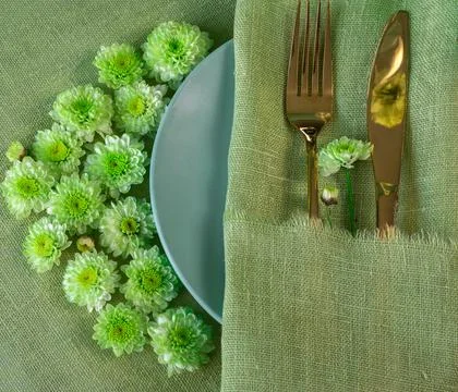Spring table setting in green tone with flowers Stock Photos