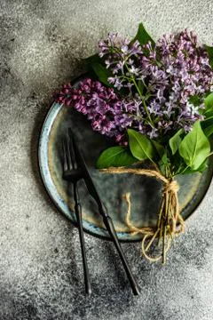 Spring table setting with lilac Stock Photos