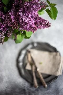 Spring table setting with lilac Stock Photos