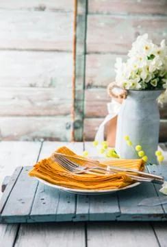 Spring table setting. Narcissus flower. Spring flowers Stock Photos