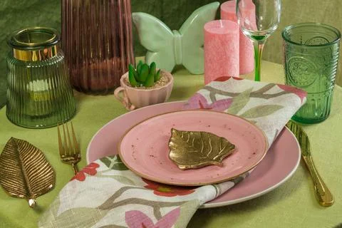 Spring table setting in pink and green colors Stock Photos