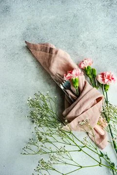 Spring table setting with pink cloves Stock Photos